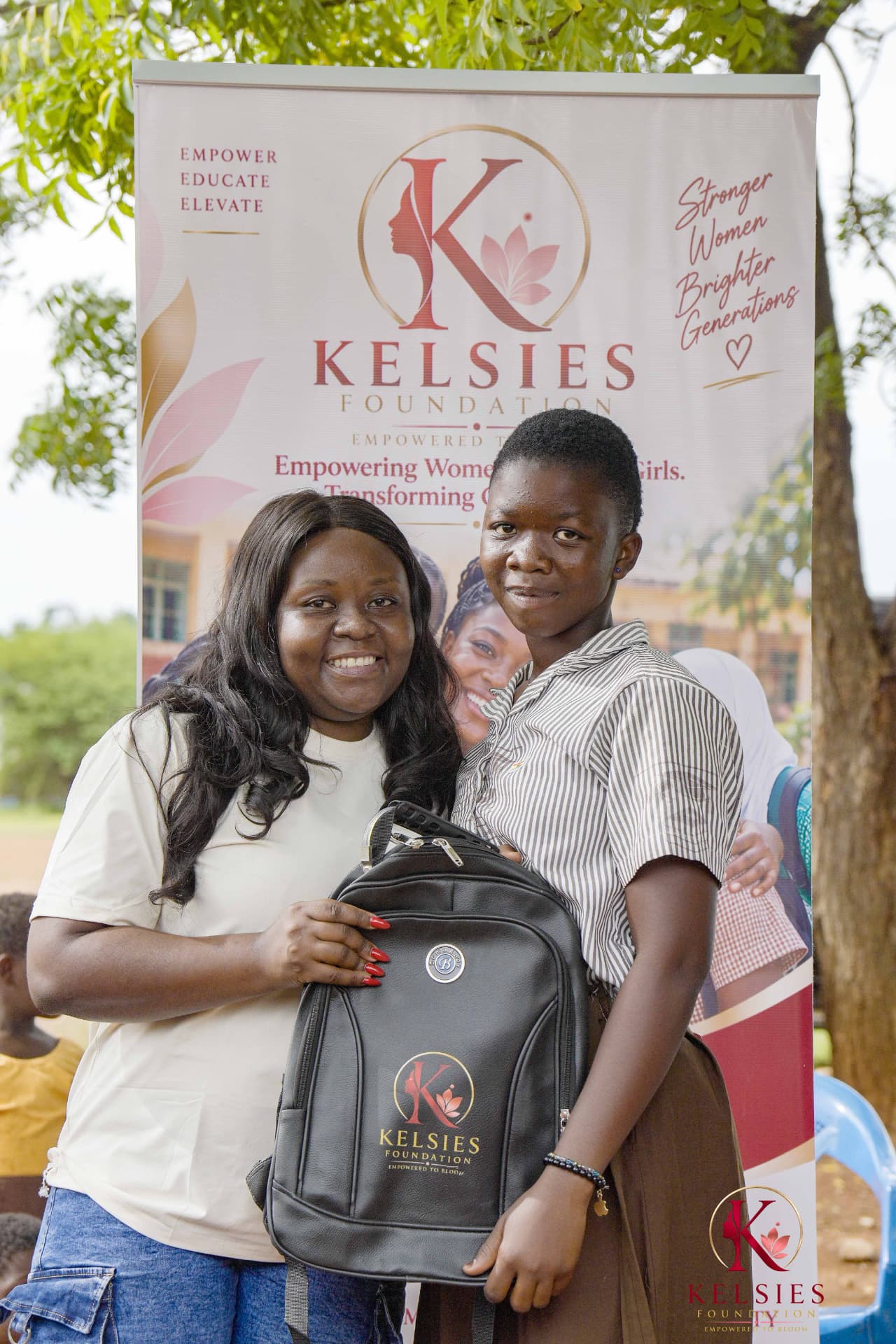 A student receiving a Kelsies Foundation school backpack