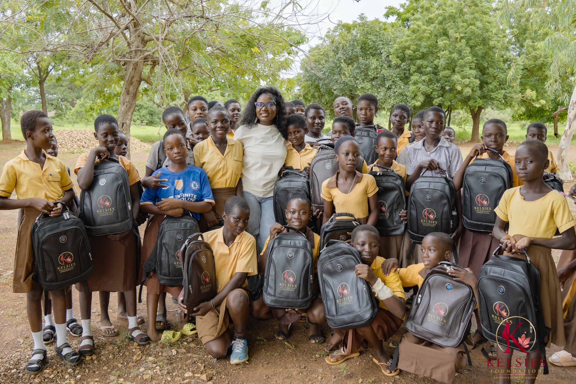 Schoolgirls gathered with their Kelsies Foundation backpacks